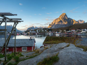 Buildings by sea against sky in city