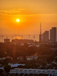 High angle view of cityscape against sky during sunset