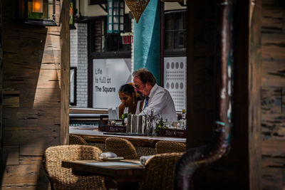 Portrait of young woman sitting at home