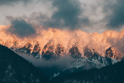 Scenic view of mountains against sky during winter