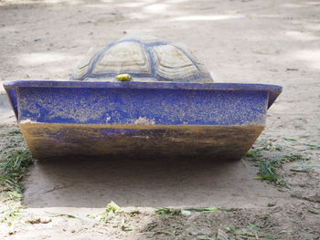 Close-up of abandoned boat on beach