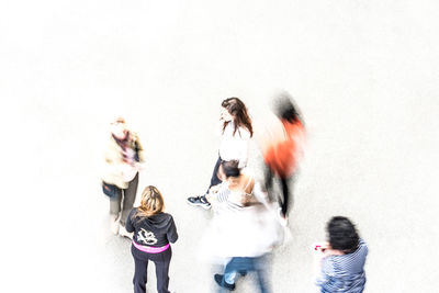 People standing against wall