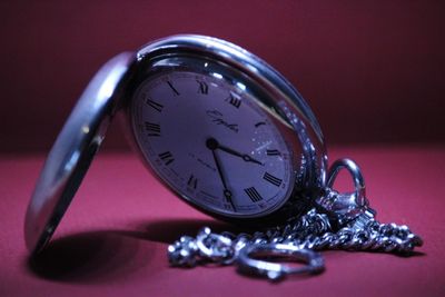 Close-up of clock on table