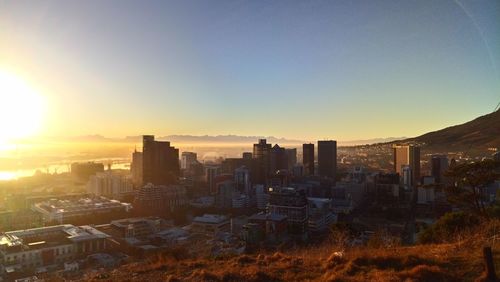 High angle view of city at sunset