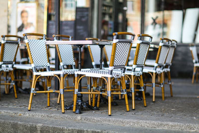 Chairs and tables at outdoor restaurant