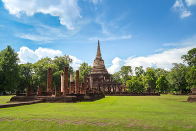 View of temple building against cloudy sky