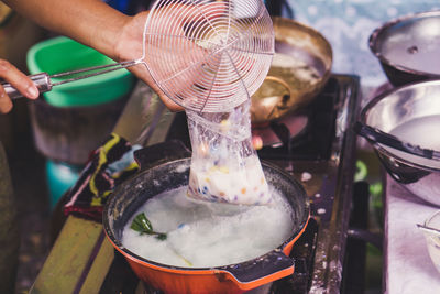 Close-up of person preparing food