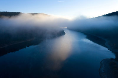 Aerial view of a misty lake. dawn dark lights during sunrise, cold weather