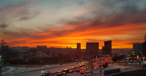 High angle view of buildings against sky during sunset