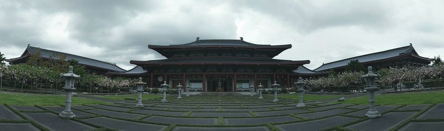 Temple against cloudy sky