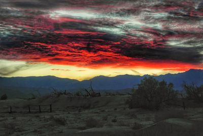 Scenic view of landscape against dramatic sky