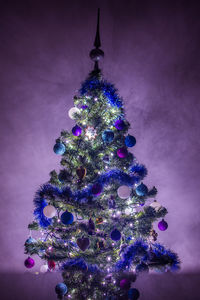 Illuminated christmas tree at night