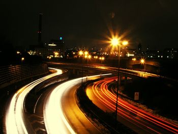 High angle view of light trails in city at night