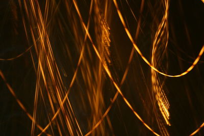 Close-up of light trails against black background