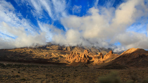 Panoramic view of landscape against dramatic sky
