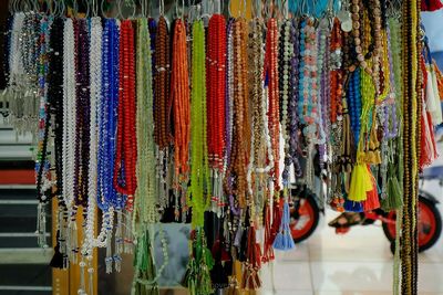 Close-up of prayer beads on display at street market stall