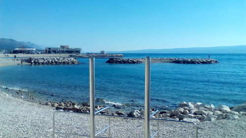 Scenic view of sea against clear blue sky