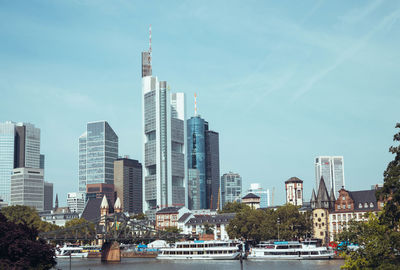 Modern buildings in city against sky