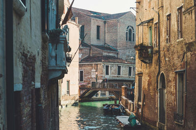 Canal amidst buildings in city