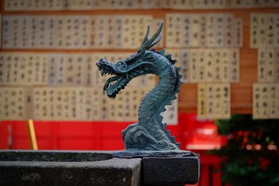 Close-up of statue against blurred background