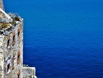 High angle view of wall by sea