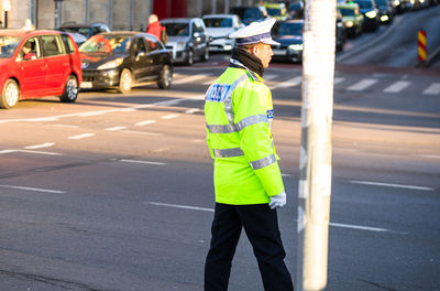 Rear view of man standing on street