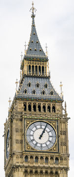 Low angle view of clock tower against sky