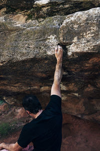 Rear view of man on rock