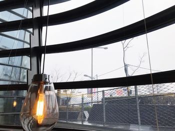 Low angle view of illuminated lamp against sky