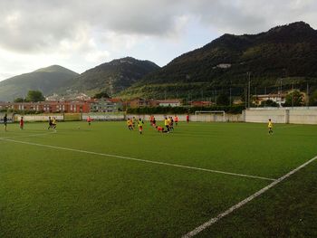 Scenic view of soccer field against sky