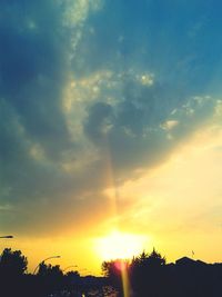 Low angle view of silhouette trees against sky during sunset