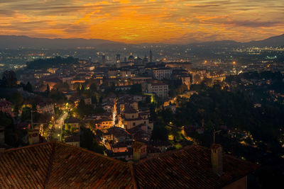 High angle view of illuminated buildings in city