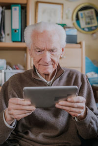 Portrait of man using mobile phone