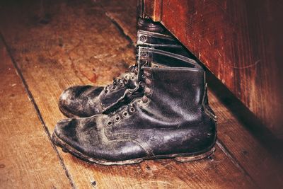 High angle view of shoes on hardwood floor