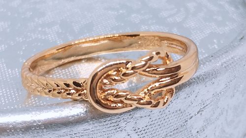 Close-up of wedding rings on table