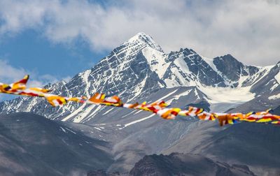 Low angle view of mountain range against sky