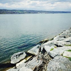 Scenic view of sea against cloudy sky