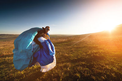 Guy holds the lines of a paraglider in his hands close-up. a male paraglider carries a paraglider to