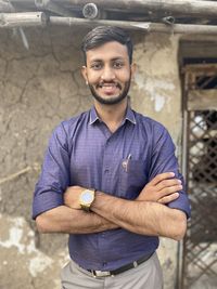 Portrait of young man standing outdoors