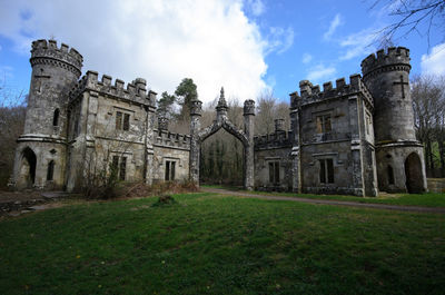 View of old building against cloudy sky