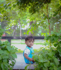 Portrait of cute baby boy looking away