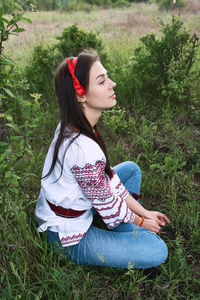 Beautiful caucasian woman in a folk costume 