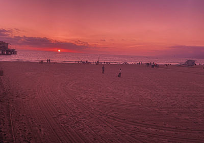 Scenic view of beach against sky during sunset