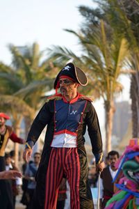 Rear view of men looking at trees