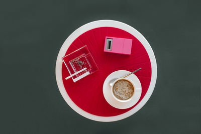 Directly above shot of coffee cup against white background