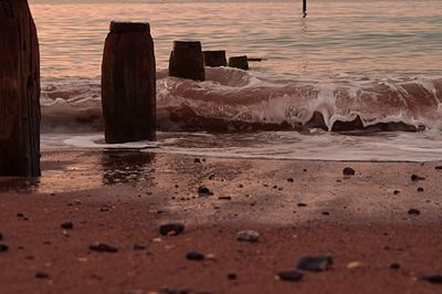 Scenic view of beach against sky during sunset