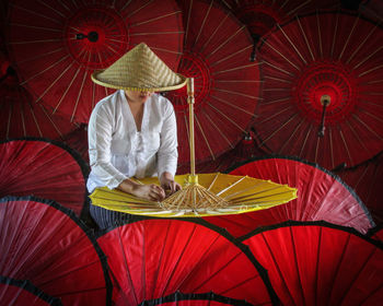 Full length of a man holding umbrella