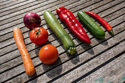 Organic garden vegetables arranged on a wooden board