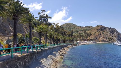 Scenic view of swimming pool by sea against sky