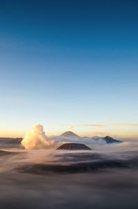 View of volcanic landscape against sky during sunset